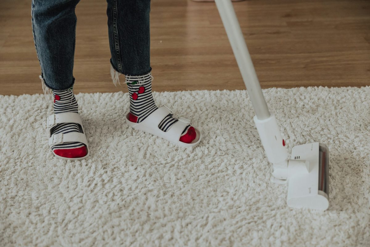 person cleaning carpet